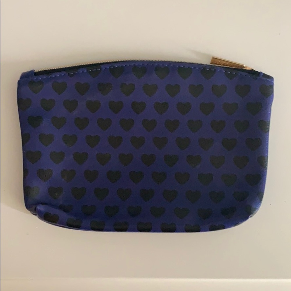 Purple makeup bag with black hearts